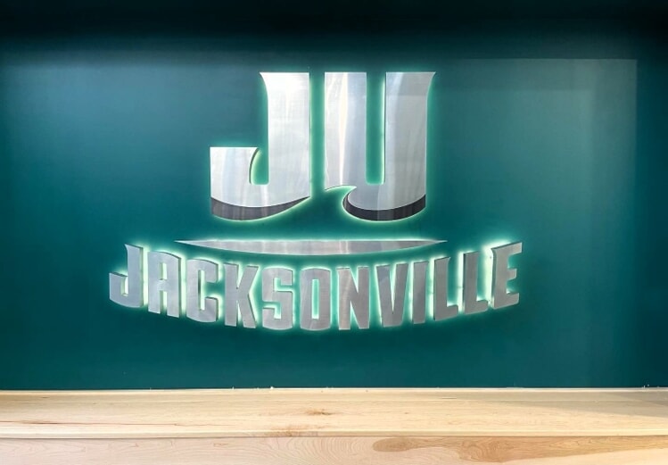 JU Basketball Facility interior lit letters